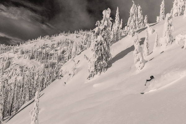 First Tracks on Evans Heaven on sunny powder morning at Whitefish Mountain Resort, Montana, USA model released