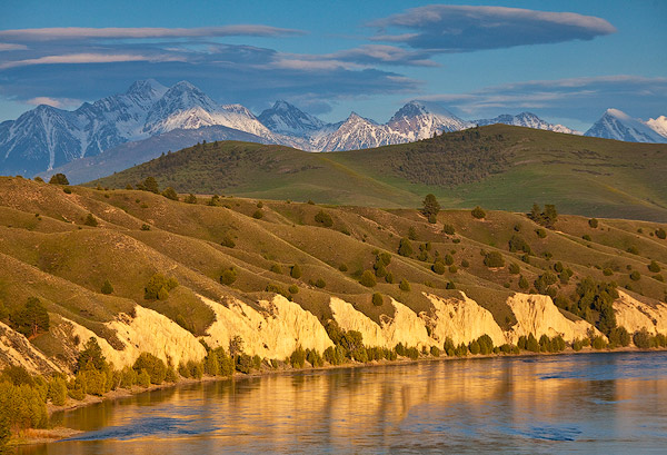 Mission Mountains loom over the Flathead River in Mission Valley, Montana, USA