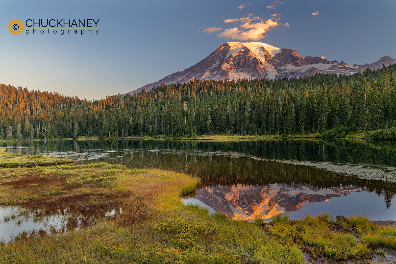 First light of the day strikes the slopes of Mount Rainier in Mount Rainier National Park in Washington